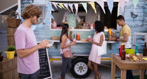 customers-having-snacks-from-food-truck-EDLBVPX.jpg